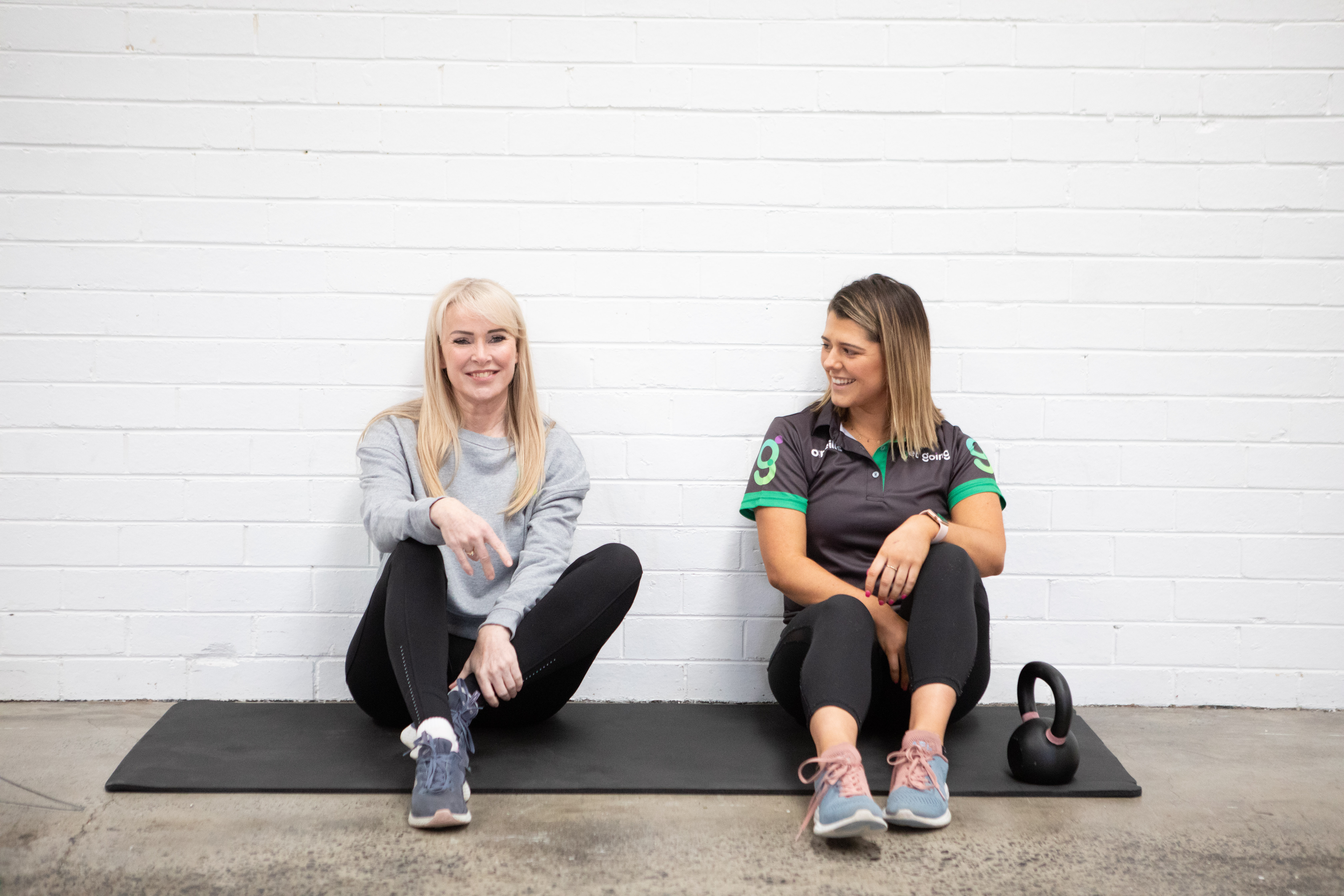 Get Going personal trainer working with a client at home